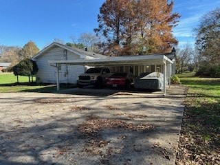 view of property exterior with a carport