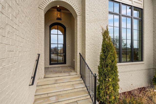 property entrance with brick siding