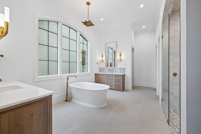 full bath featuring recessed lighting, two vanities, baseboards, ornamental molding, and a soaking tub