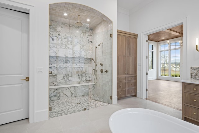 full bathroom featuring a soaking tub, tile patterned floors, vanity, a shower stall, and recessed lighting