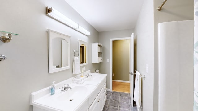 bathroom featuring tile patterned flooring and vanity