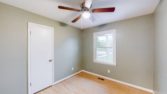 unfurnished room featuring ceiling fan and light wood-type flooring