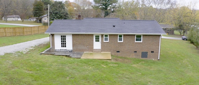 back of house featuring a yard, a patio area, and central air condition unit