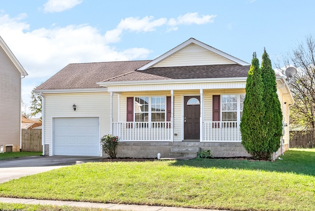 view of front of home with covered porch, a front yard, and a garage