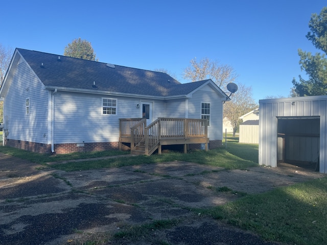 rear view of property featuring a deck