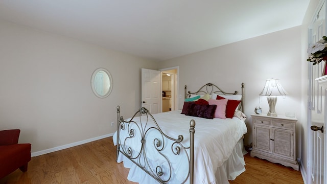 bedroom with light hardwood / wood-style floors