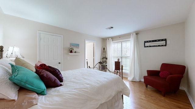 bedroom with light hardwood / wood-style floors