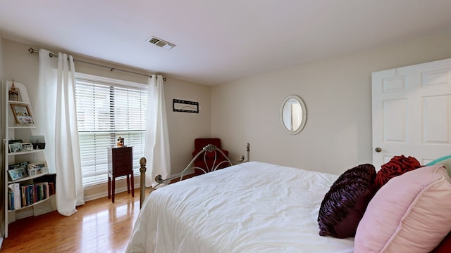 bedroom featuring hardwood / wood-style floors