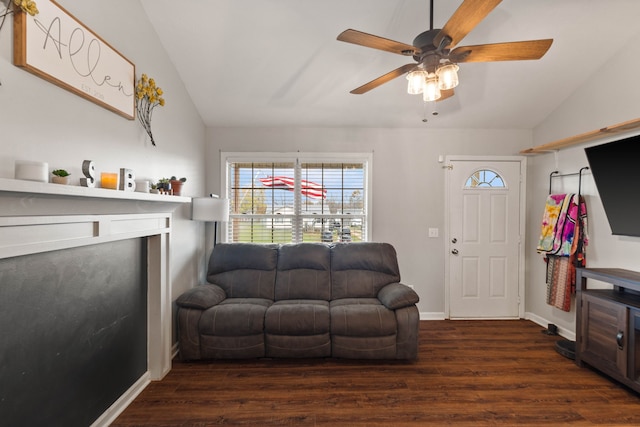 living room with ceiling fan, dark hardwood / wood-style flooring, and vaulted ceiling