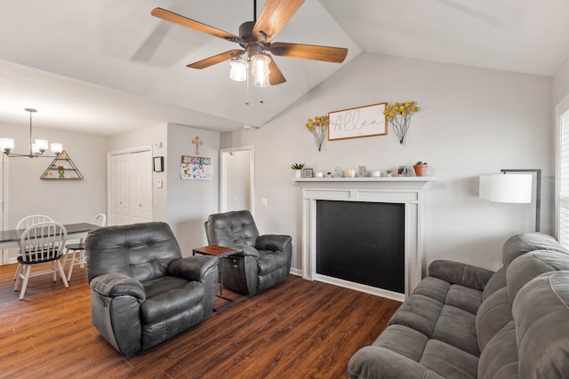 living room featuring ceiling fan with notable chandelier, dark hardwood / wood-style floors, and lofted ceiling