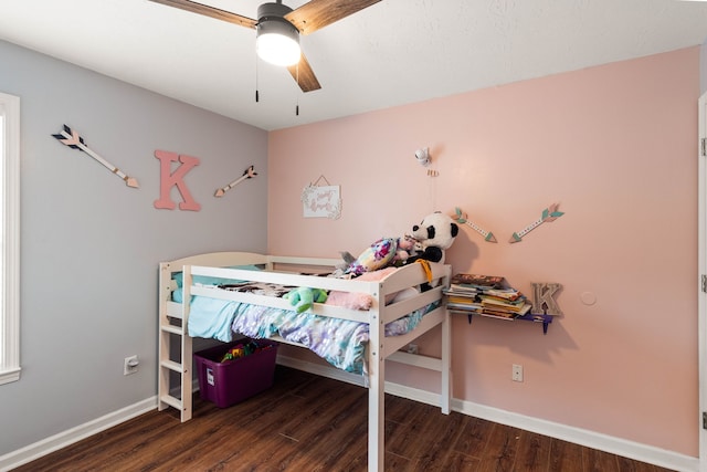 bedroom featuring ceiling fan and dark hardwood / wood-style flooring