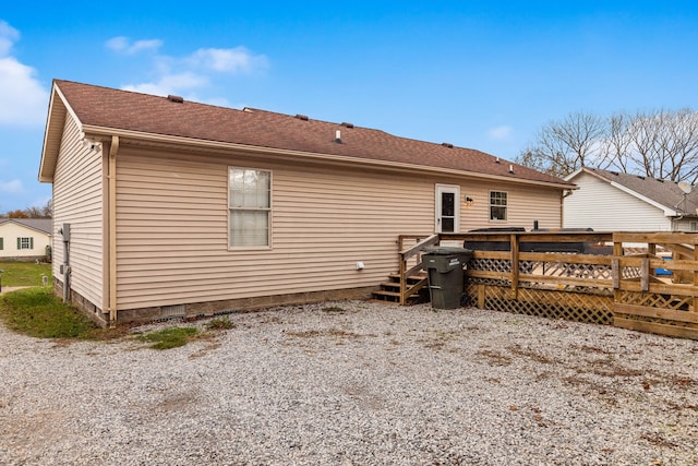 back of house with a wooden deck