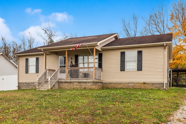 ranch-style house with a front lawn and covered porch