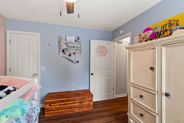 bedroom featuring dark hardwood / wood-style floors and ceiling fan