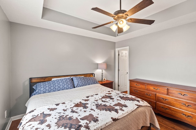 bedroom featuring ceiling fan and hardwood / wood-style floors