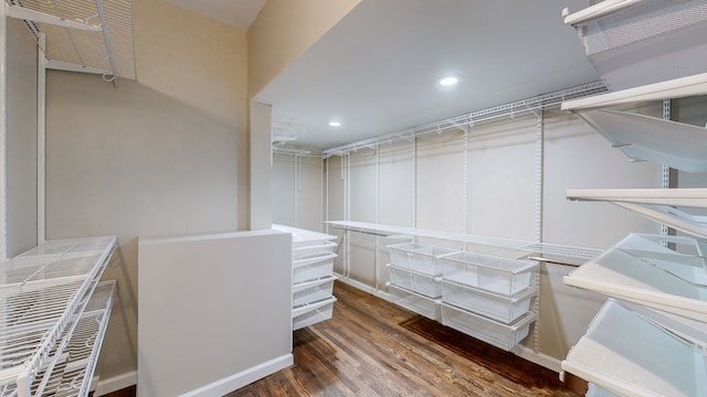 walk in closet featuring dark hardwood / wood-style flooring