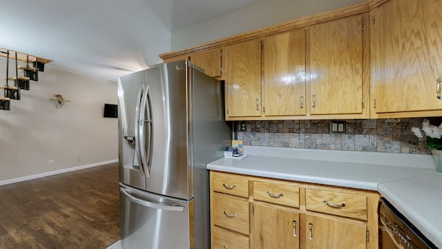 kitchen featuring decorative backsplash, stainless steel fridge with ice dispenser, dishwasher, and dark wood-type flooring