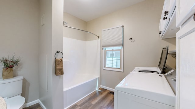 clothes washing area with independent washer and dryer and light hardwood / wood-style flooring