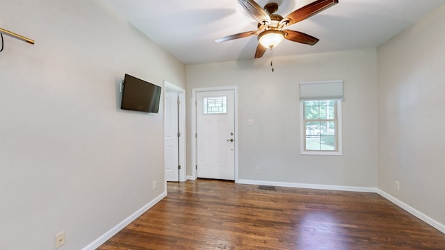 foyer entrance featuring dark hardwood / wood-style flooring and ceiling fan