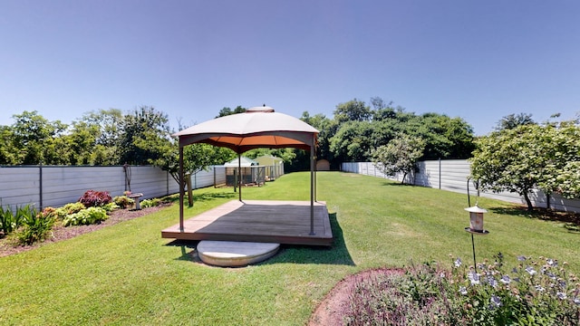 view of yard featuring a gazebo and a deck