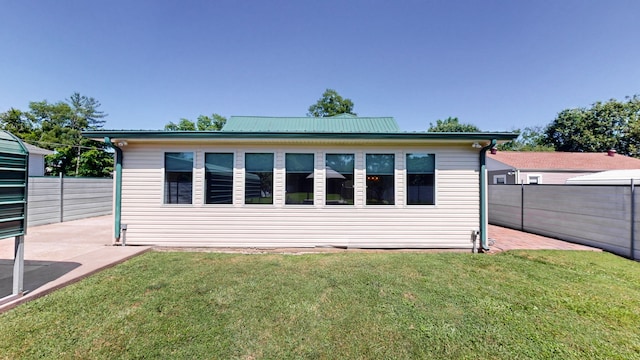 exterior space featuring a lawn and a patio