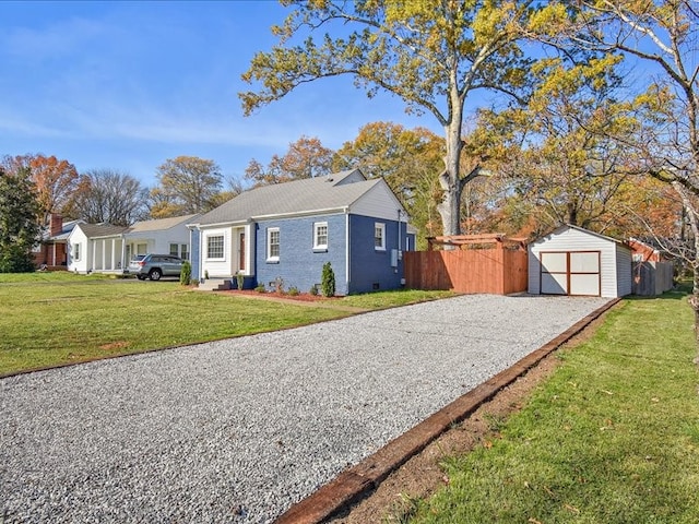 view of property exterior with a yard, an outdoor structure, and a garage