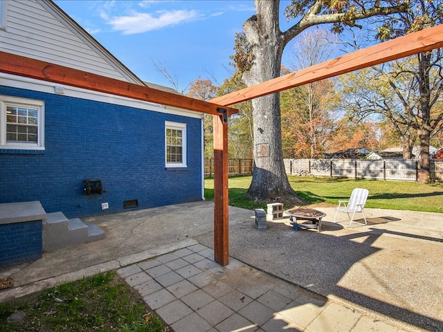 view of patio / terrace featuring an outdoor fire pit