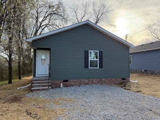 view of front of home featuring crawl space and entry steps