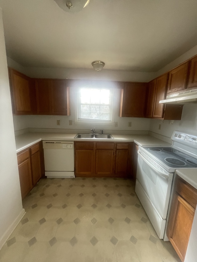 kitchen with sink and white appliances