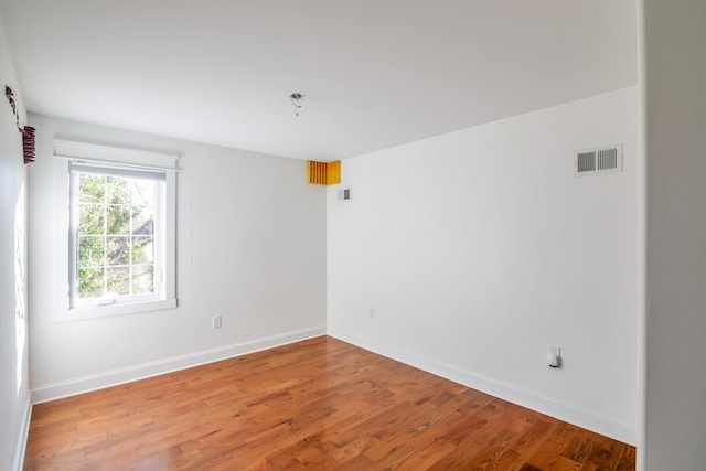 empty room featuring hardwood / wood-style floors