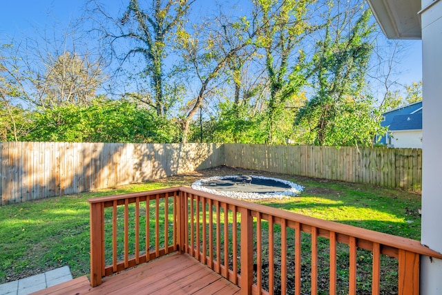 wooden deck with a lawn