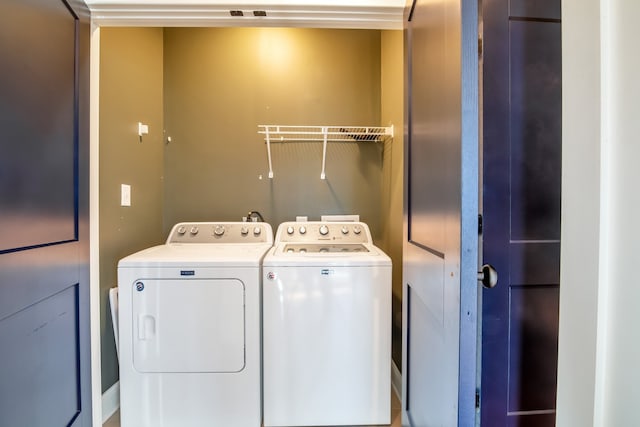 laundry area with washing machine and clothes dryer