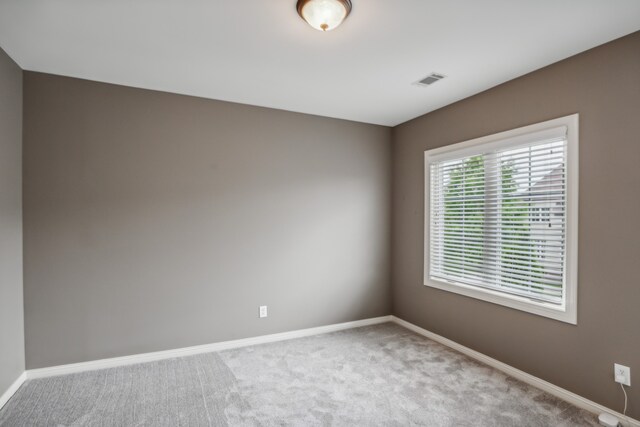 empty room with carpet flooring