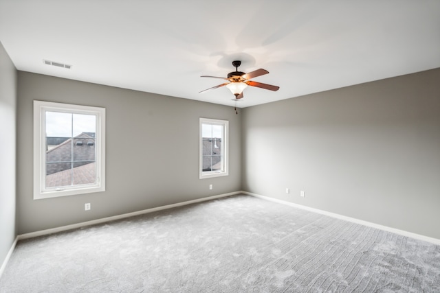 carpeted empty room with ceiling fan