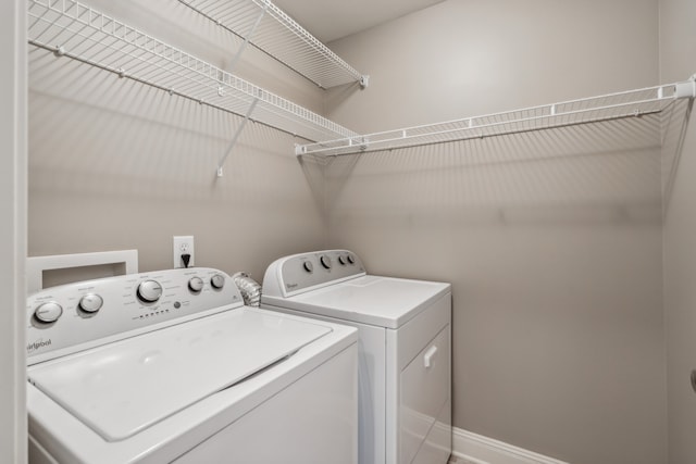 clothes washing area featuring washing machine and dryer