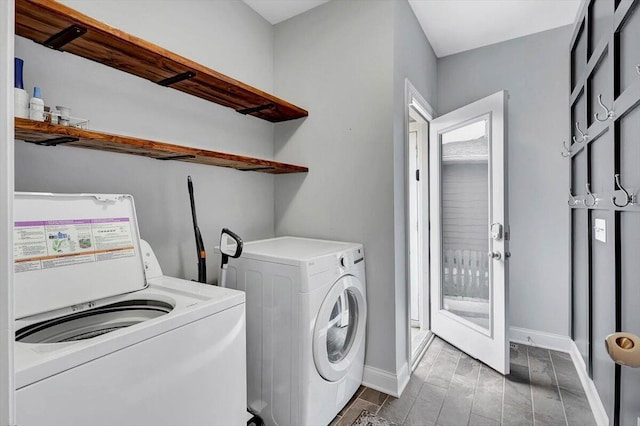 clothes washing area featuring separate washer and dryer and hardwood / wood-style flooring