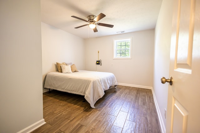 bedroom with wood-type flooring and ceiling fan