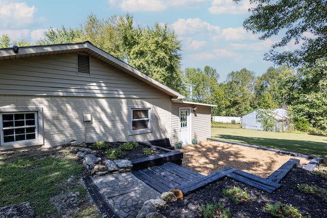 back of house with a yard