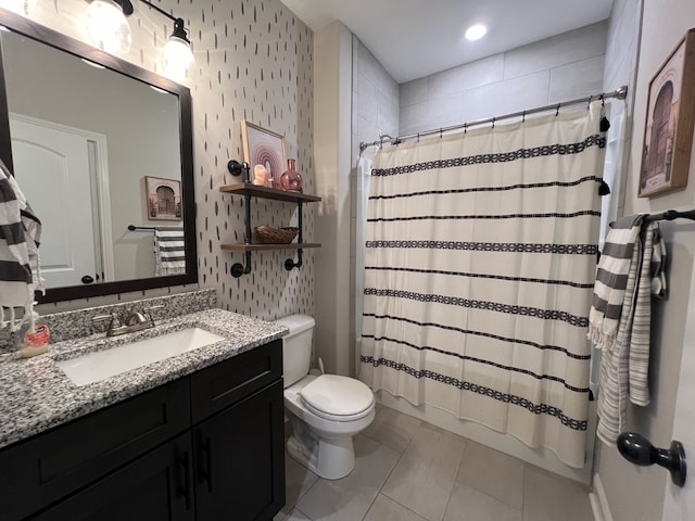 full bathroom with wallpapered walls, shower / bath combo, toilet, tile patterned floors, and vanity