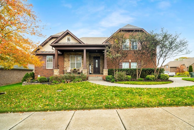 craftsman-style home featuring a front yard