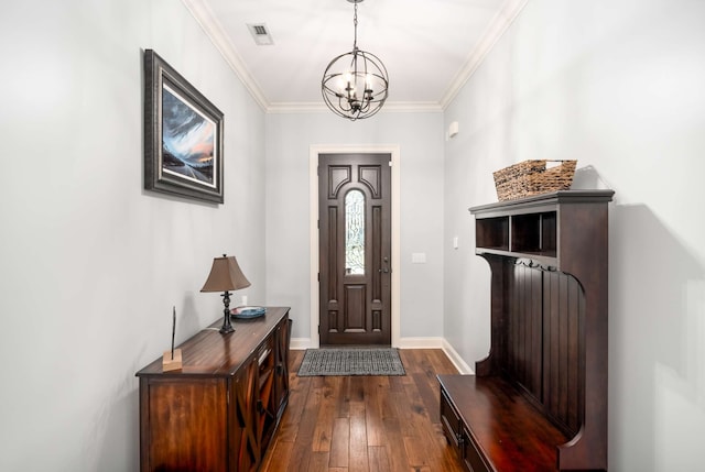 entrance foyer with crown molding, dark hardwood / wood-style flooring, and an inviting chandelier