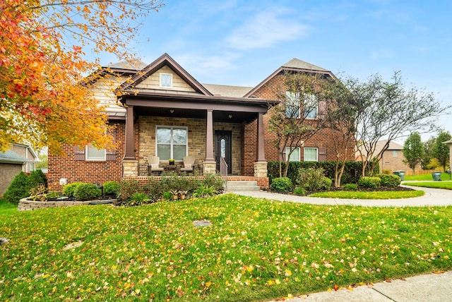 craftsman-style house with a front yard