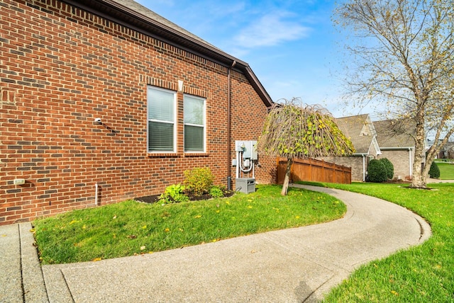 view of home's exterior with a yard