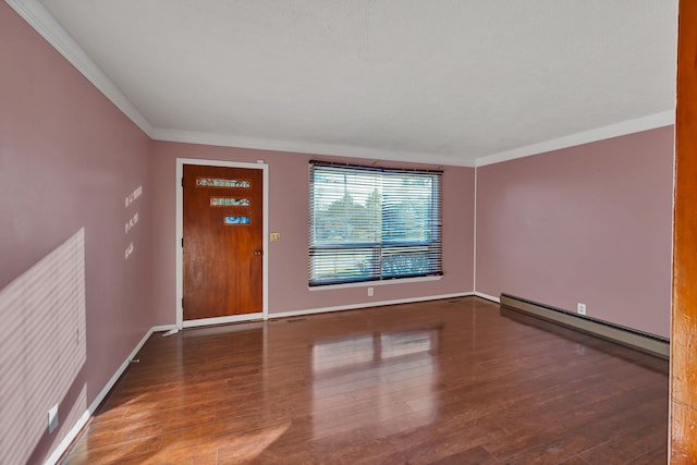 foyer entrance featuring dark hardwood / wood-style flooring, ornamental molding, and baseboard heating