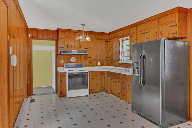 kitchen with wood walls, white range with electric stovetop, decorative light fixtures, a notable chandelier, and stainless steel fridge with ice dispenser