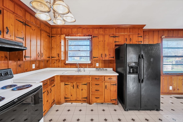 kitchen with black fridge, sink, wooden walls, ornamental molding, and white electric range oven