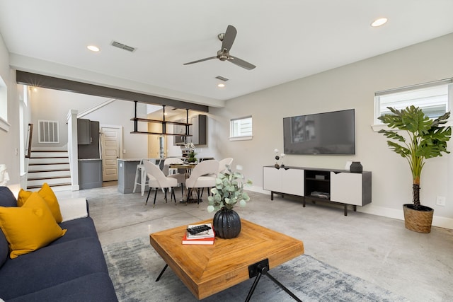 living room with ceiling fan