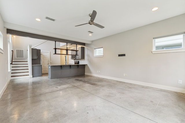 interior space with ceiling fan