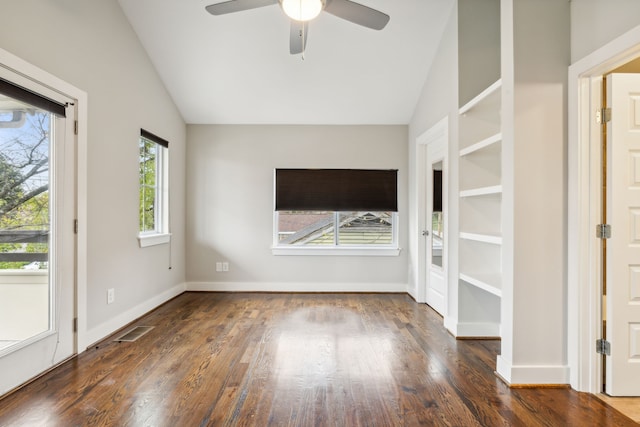 spare room with dark wood-type flooring, ceiling fan, and lofted ceiling