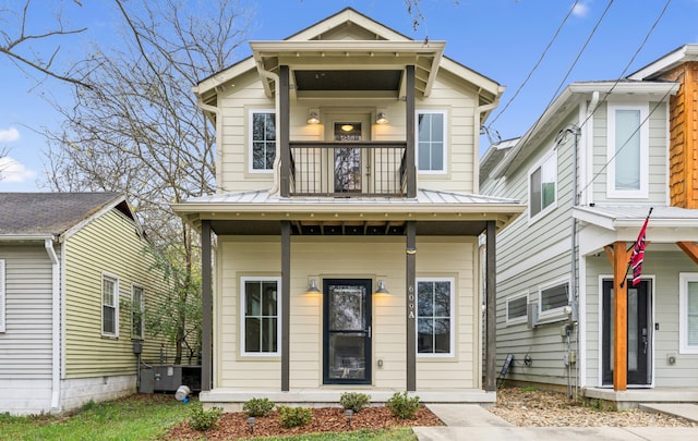 view of front of house featuring covered porch and a balcony